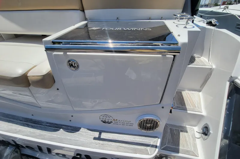 Isabella IV Yacht Photos Pics 2012 Four Winns V435 boat interior with seating and storage area.