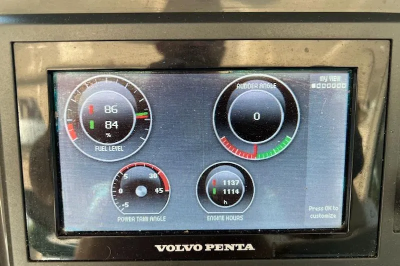 Isabella IV Yacht Photos Pics Volvo Penta dashboard display on 2012 Four Winns V435 boat, showing fuel, rudder, and engine data.