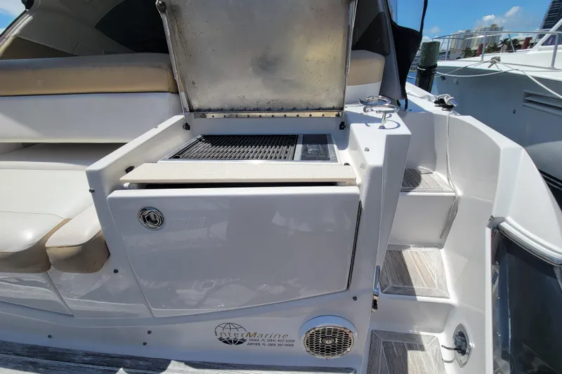 Isabella IV Yacht Photos Pics 2012 Four Winns V435 yacht with outdoor grill and seating area.