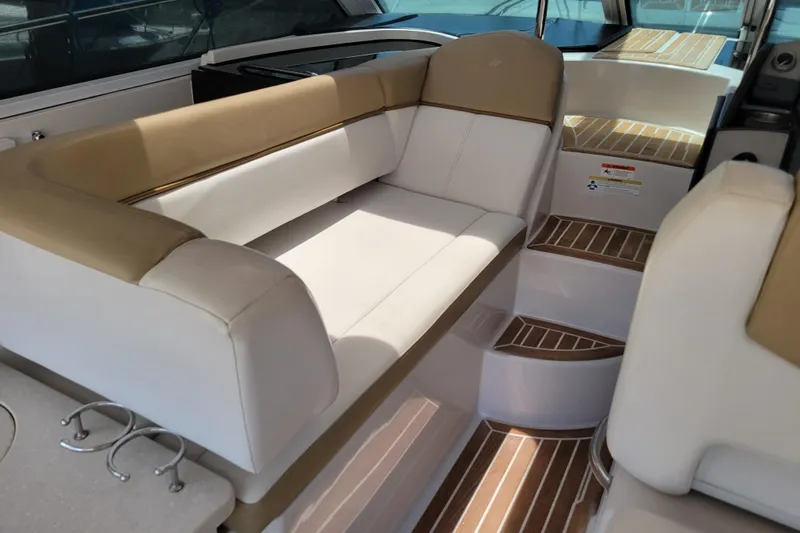 Isabella IV Yacht Photos Pics Luxurious seating area on 2012 Four Winns V435 yacht with elegant wood-accented steps.