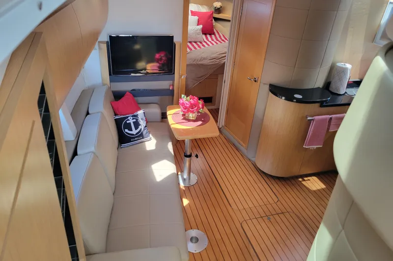 Isabella IV Yacht Photos Pics Luxurious interior of 2012 Four Winns V435 yacht with cozy seating and modern amenities.