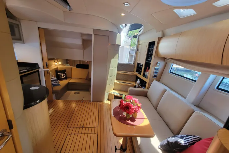 Isabella IV Yacht Photos Pics Luxurious 2012 Four Winns V435 yacht interior with elegant seating and modern amenities.