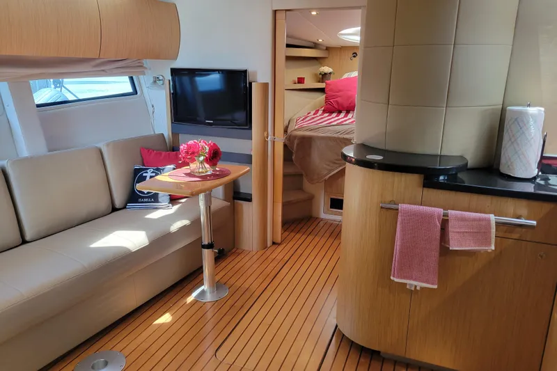 Isabella IV Yacht Photos Pics Luxurious 2012 Four Winns V435 yacht interior with modern furnishings and cozy cabin.