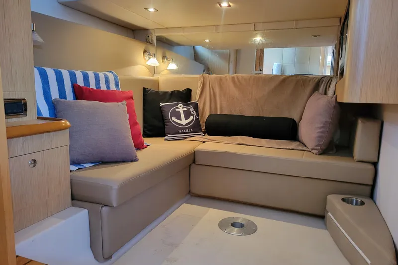 Isabella IV Yacht Photos Pics Interior of 2012 Four Winns V435 yacht with cozy seating and decorative pillows.