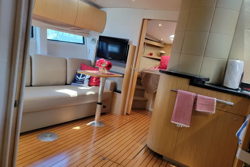 Isabella IV Yacht Photos Pics Luxurious interior of 2012 Four Winns V435 yacht with modern furnishings and elegant decor.