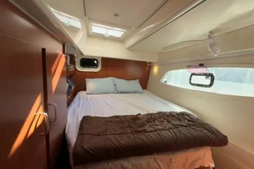 The Light Yacht Photos Pics Cozy bedroom in 2014 Leopard 44 yacht with natural light and modern design.