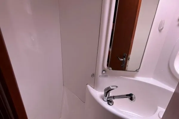 The Light Yacht Photos Pics Bathroom interior of 2014 Leopard 44 yacht with sink and mirror.