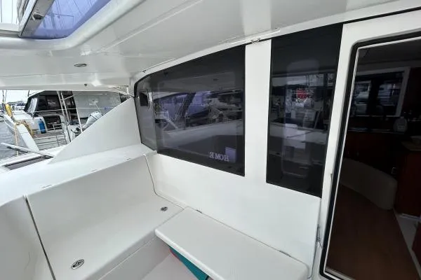 The Light Yacht Photos Pics 2014 Leopard 44 catamaran interior with seating and window view.
