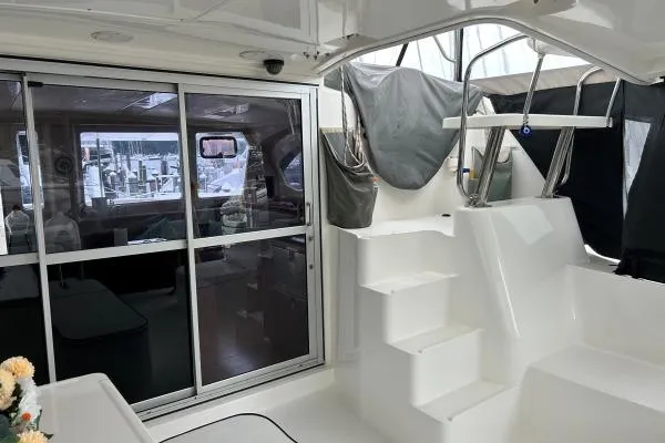 The Light Yacht Photos Pics Interior view of 2014 Leopard 44 catamaran with sliding glass doors and white steps.