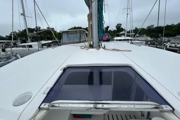 The Light Yacht Photos Pics 2014 Leopard 44 catamaran deck view with marina background.