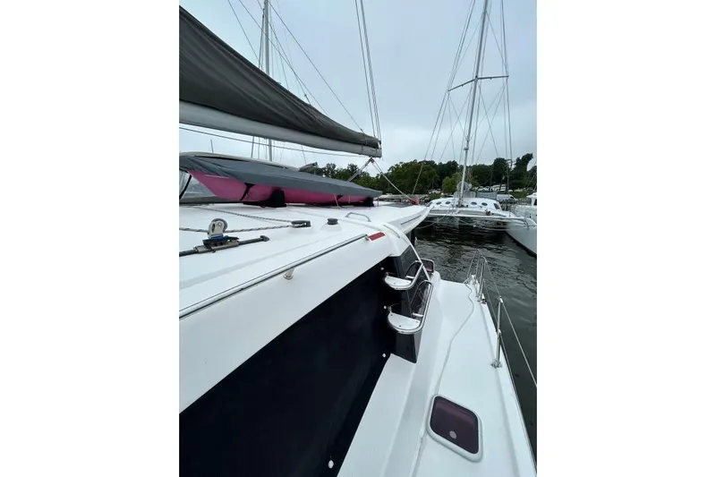 The Light Yacht Photos Pics 2014 Leopard 44 catamaran docked, showcasing sleek design and spacious deck.