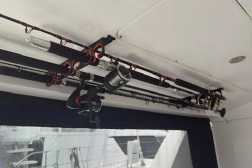 The Light Yacht Photos Pics Fishing rods stored on a 2014 Leopard 44 yacht's ceiling rack.
