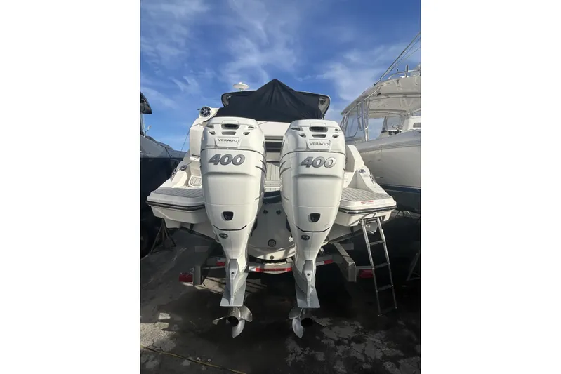  Yacht Photos Pics 2019 Sea Ray SLX 350 Outboard with twin Verado 400 engines, docked under blue sky.