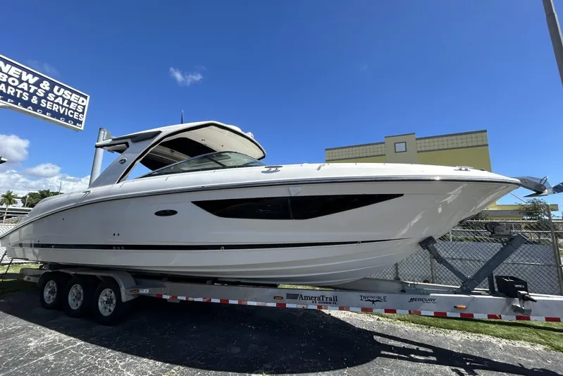  Yacht Photos Pics 2019 Sea Ray SLX 350 Outboard boat on trailer under clear blue sky.