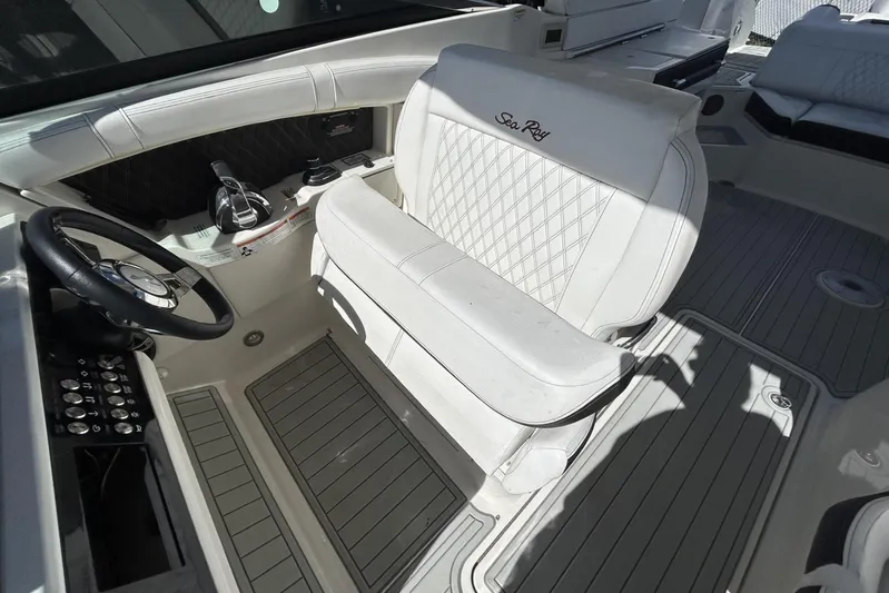  Yacht Photos Pics 2019 Sea Ray SLX 350 Outboard cockpit with luxurious white seating and modern controls.