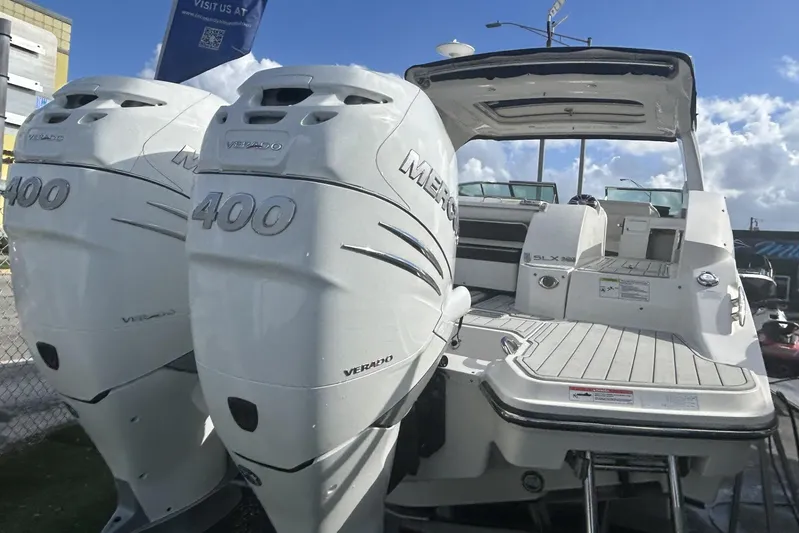  Yacht Photos Pics 2019 Sea Ray SLX 350 Outboard with twin Mercury Verado 400 engines, docked under blue sky.