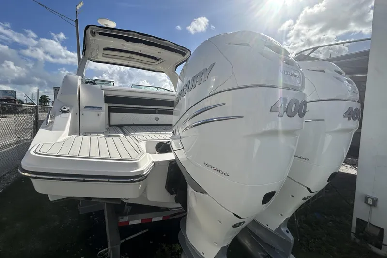  Yacht Photos Pics 2019 Sea Ray SLX 350 Outboard with twin Mercury 400 engines, docked under sunny skies.