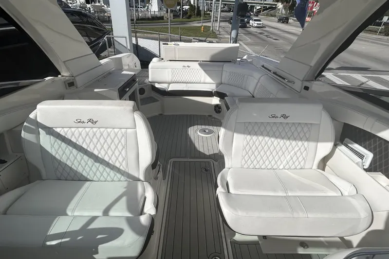  Yacht Photos Pics 2019 Sea Ray SLX 350 Outboard interior with luxurious white seating and spacious layout.