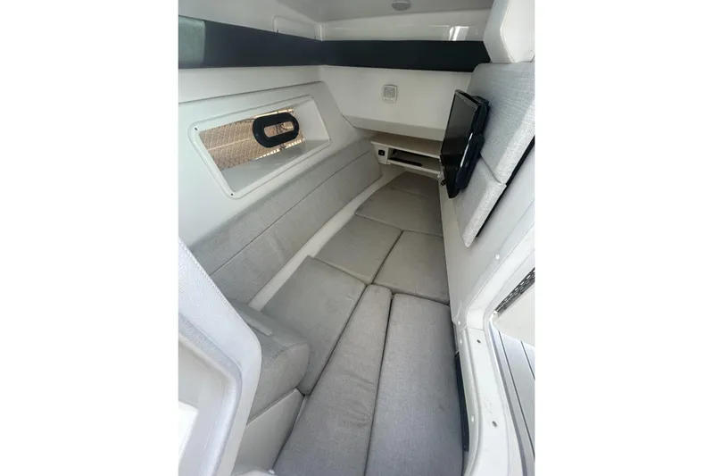  Yacht Photos Pics 2019 Sea Ray SLX 350 Outboard cabin interior with gray seating and window.
