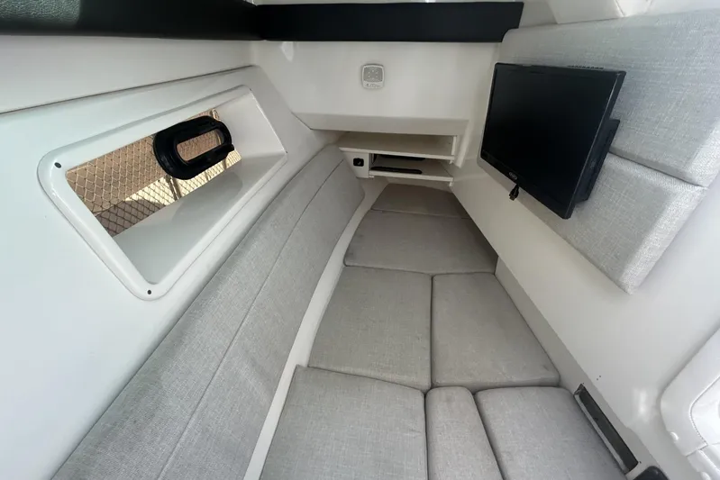  Yacht Photos Pics 2019 Sea Ray SLX 350 Outboard cabin interior with TV and seating.