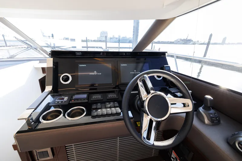 Yacht Photos Pics 2023 Prestige 520 F-Line yacht helm with modern controls and dual displays.