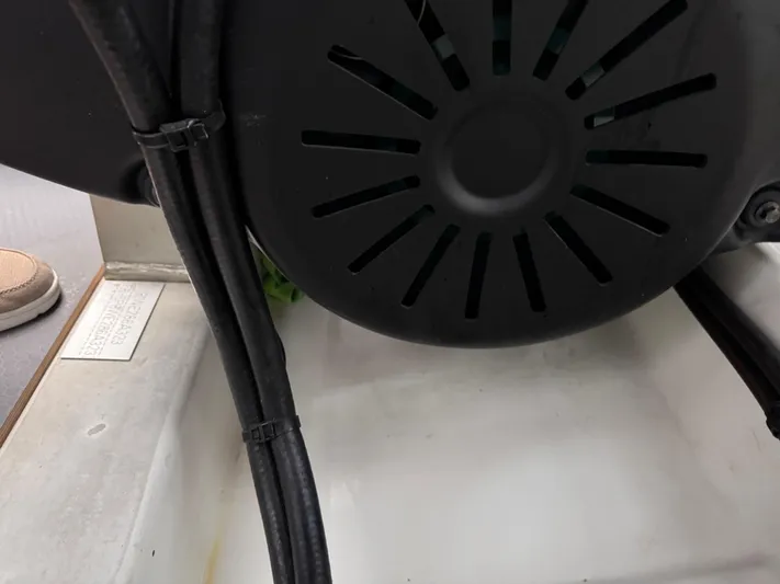  Yacht Photos Pics Engine compartment of a 2023 Prestige 520 F-Line yacht, featuring cables and ventilation.