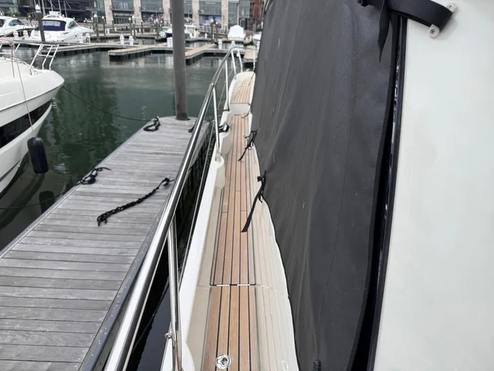  Yacht Photos Pics 2023 Prestige 520 F-Line yacht docked, showcasing sleek deck design and marina setting.
