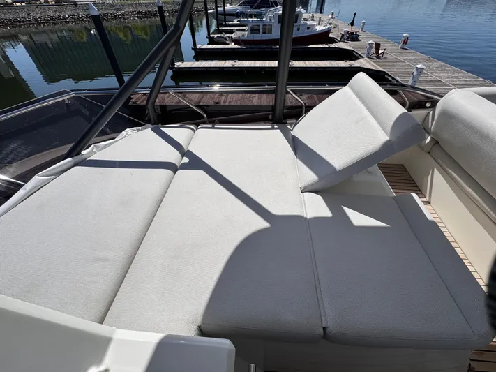  Yacht Photos Pics Luxurious seating on 2023 Prestige 520 F-Line yacht at marina.