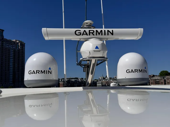  Yacht Photos Pics Garmin radar equipment on 2023 Prestige 520 F-Line yacht under clear blue sky.
