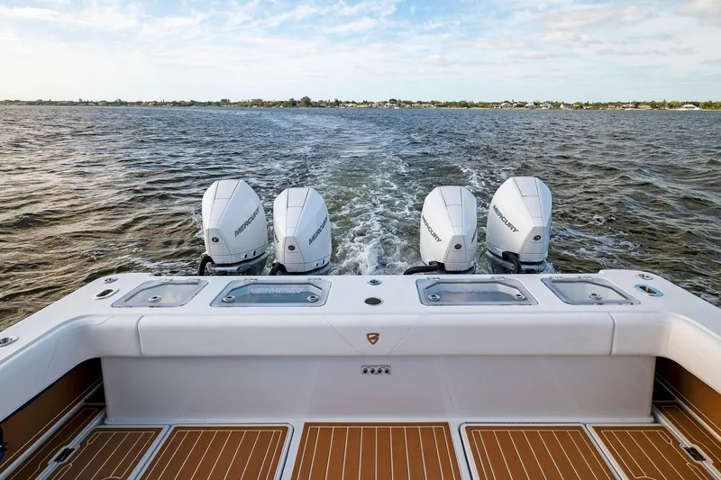  Yacht Photos Pics 2022 Barker Boatworks 40 HPC with four Mercury outboard engines on open water.