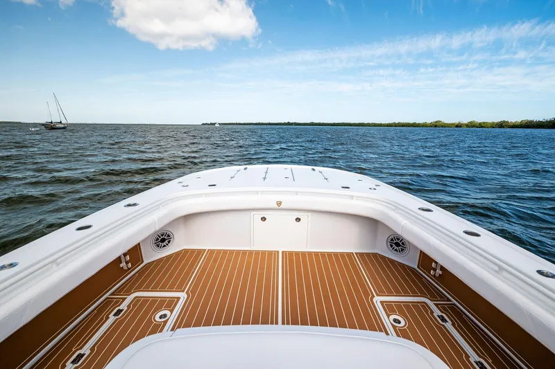  Yacht Photos Pics 2022 Barker Boatworks 40 HPC on open water, featuring spacious deck and clear skies.