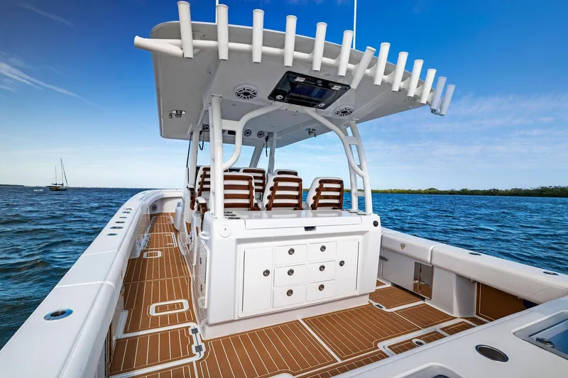  Yacht Photos Pics 2022 Barker Boatworks 40 HPC on water, featuring spacious deck and seating.