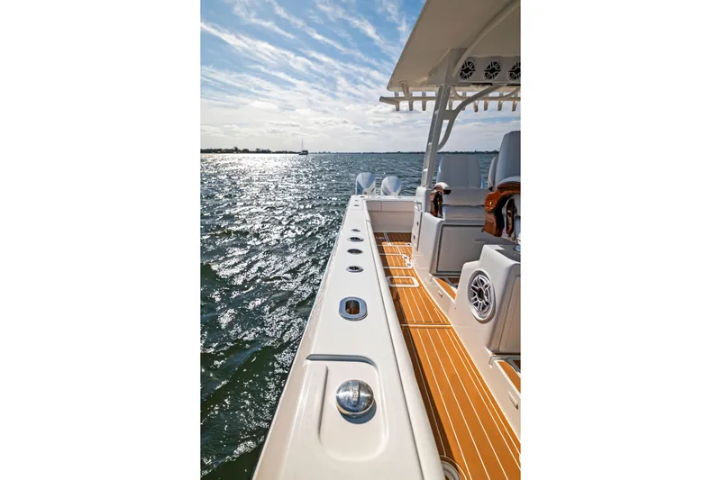  Yacht Photos Pics 2022 Barker Boatworks 40 HPC on water, showcasing deck and seating area.