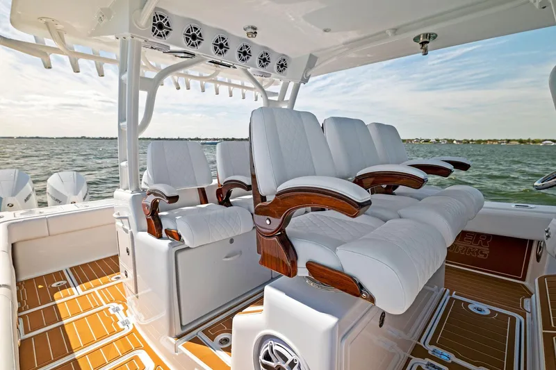  Yacht Photos Pics 2022 Barker Boatworks 40 HPC interior with luxurious seating and ocean view.