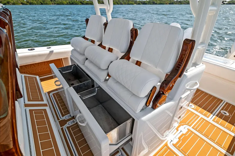  Yacht Photos Pics Luxury seating on 2022 Barker Boatworks 40 HPC, featuring white cushions and storage compartments.