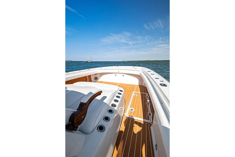  Yacht Photos Pics 2022 Barker Boatworks 40 HPC on water, showcasing deck and seating under clear blue sky.