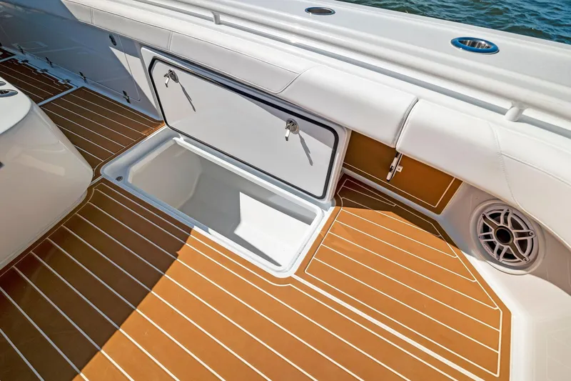  Yacht Photos Pics 2022 Barker Boatworks 40 HPC deck with storage compartment and marine speaker.