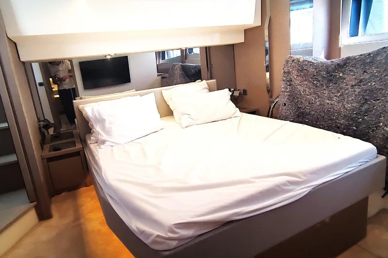  Yacht Photos Pics Luxurious bedroom interior of 2023 Jeanneau Prestige 520 Fly yacht.