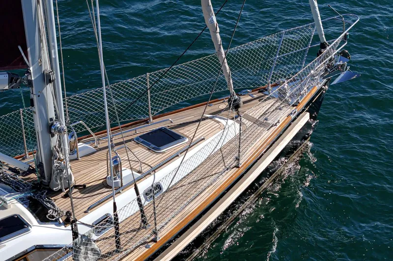 Feather Yacht Photos Pics Hylas 46 sailboat from 2012 with teak deck on calm water.