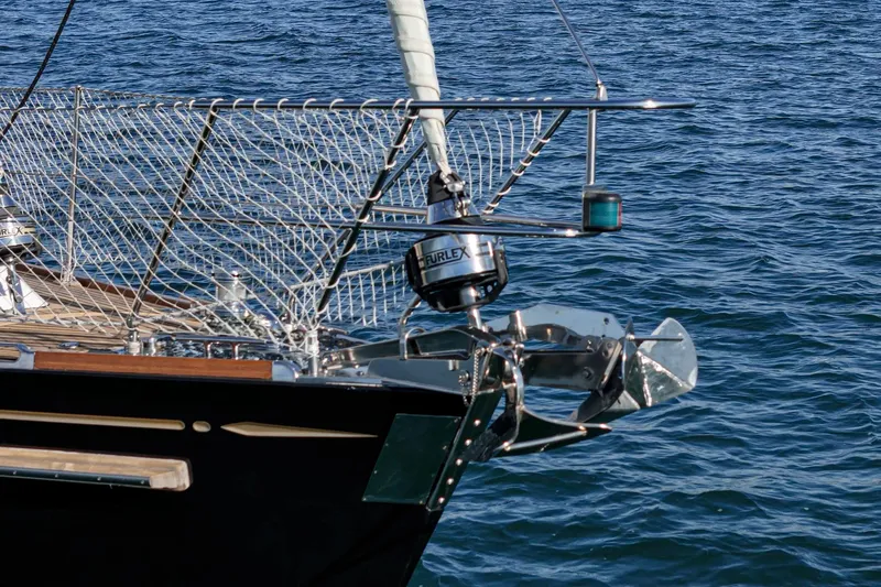 Feather Yacht Photos Pics Hylas 46 sailboat bow with stainless steel fittings, 2012 model, on calm blue water.