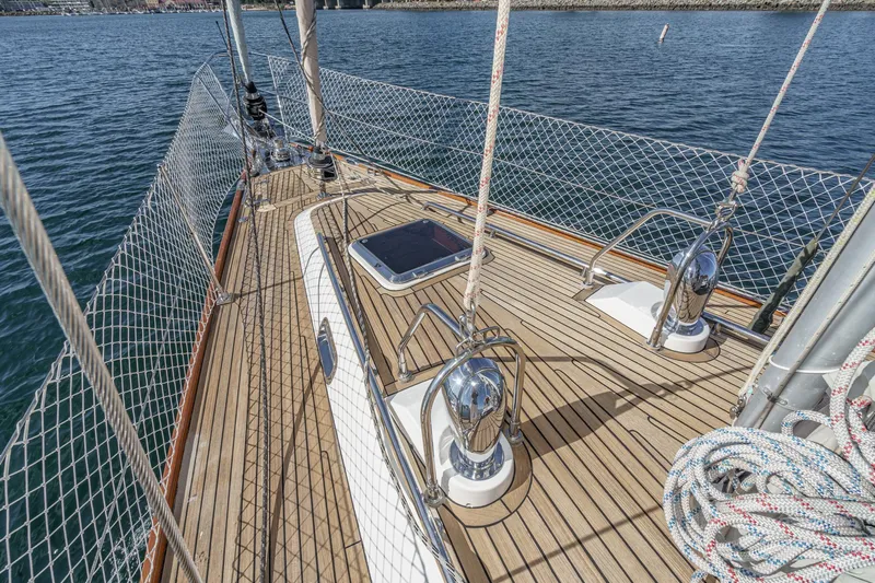 Feather Yacht Photos Pics 2012 Hylas 46 sailboat deck with polished fittings and safety netting on calm water.