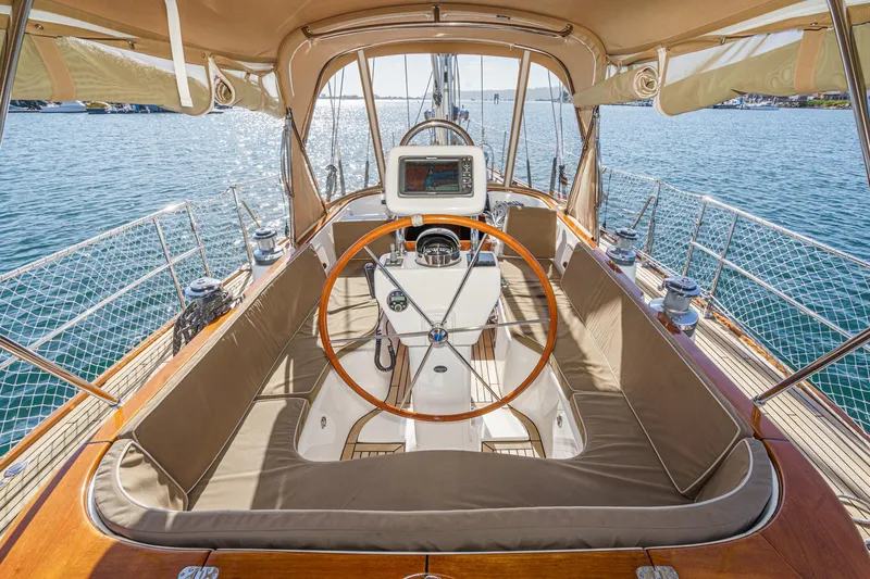 Feather Yacht Photos Pics Luxurious 2012 Hylas 46 yacht cockpit with wooden wheel and navigation system.