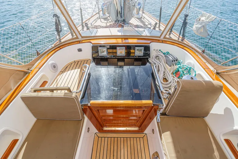 Feather Yacht Photos Pics Luxurious 2012 Hylas 46 yacht cockpit with teak seating and navigation equipment.