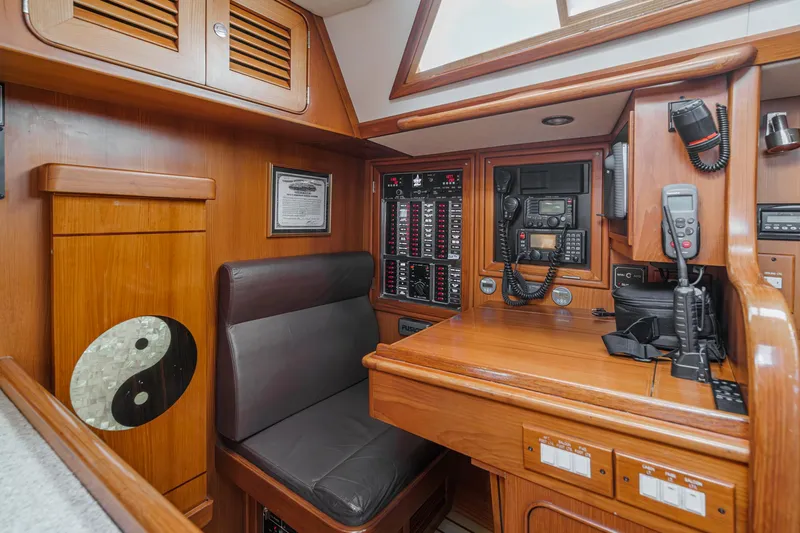 Feather Yacht Photos Pics Interior of 2012 Hylas 46 yacht with navigation station and communication equipment.