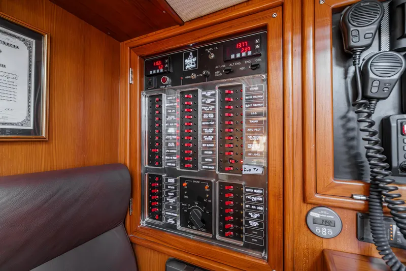 Feather Yacht Photos Pics Electrical control panel on a 2012 Hylas 46 yacht, featuring switches and communication devices.