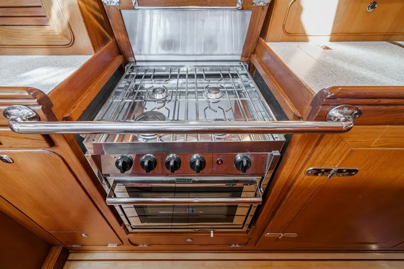 Feather Yacht Photos Pics Stainless steel stove in 2012 Hylas 46 yacht kitchen.