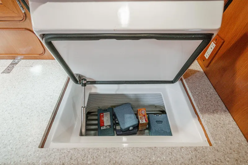 Feather Yacht Photos Pics Open storage compartment on 2012 Hylas 46 yacht interior.