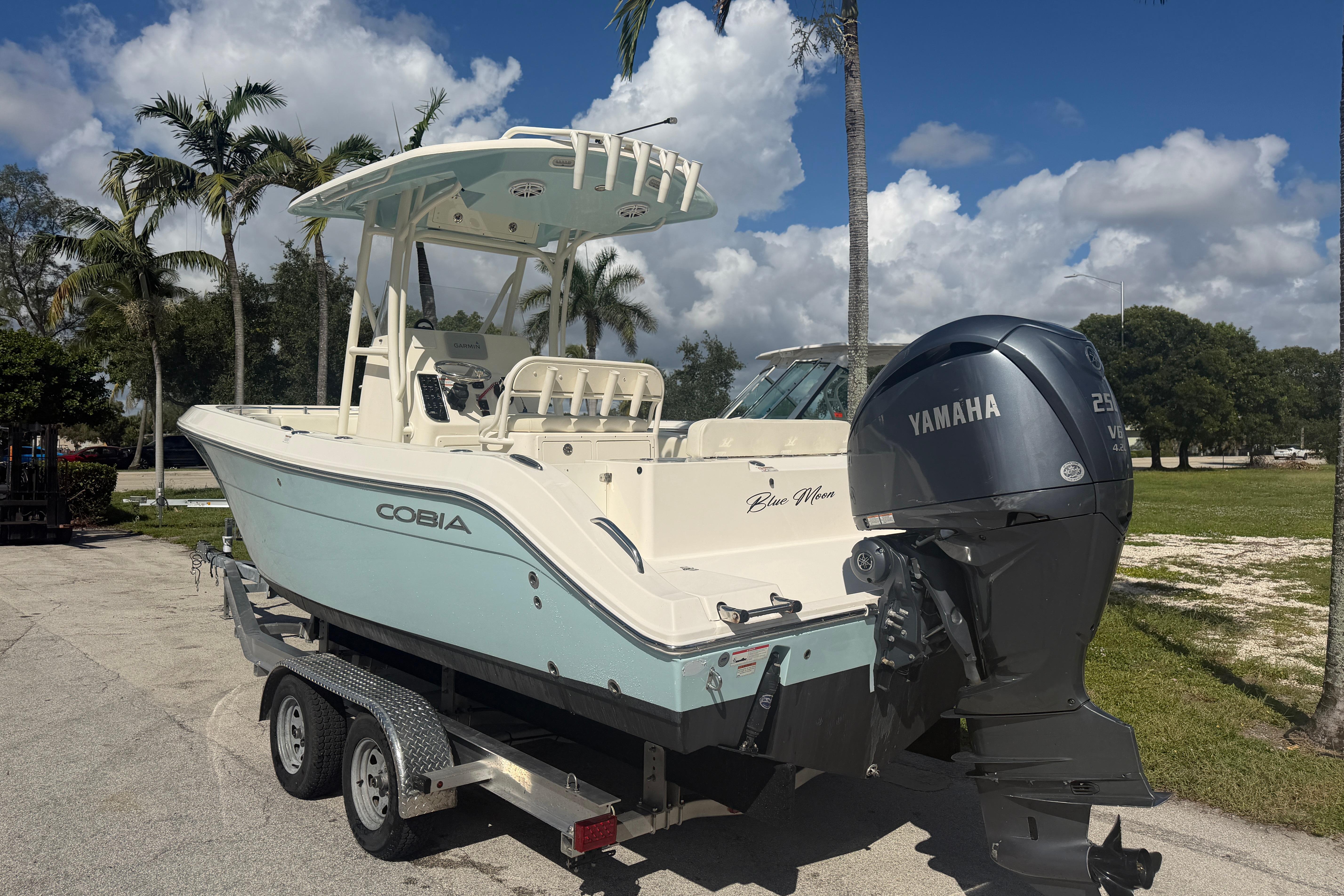 2021 Cobia 237 Center Console boat with Yamaha engine on trailer.