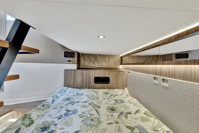  Yacht Photos Pics 2024 Sea Ray Sundancer 370 Outboard cabin interior with floral bedding and modern design.