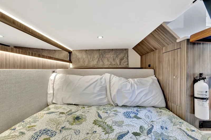  Yacht Photos Pics Cozy cabin interior of 2024 Sea Ray Sundancer 370 Outboard with floral bedding.